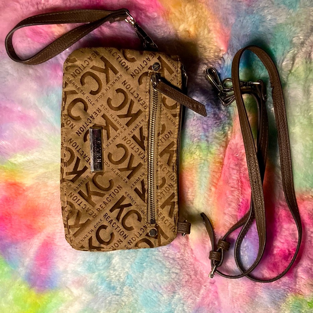 I am selling a Kenneth Cole purse it has 1 mini pocket and 2 big pockets
